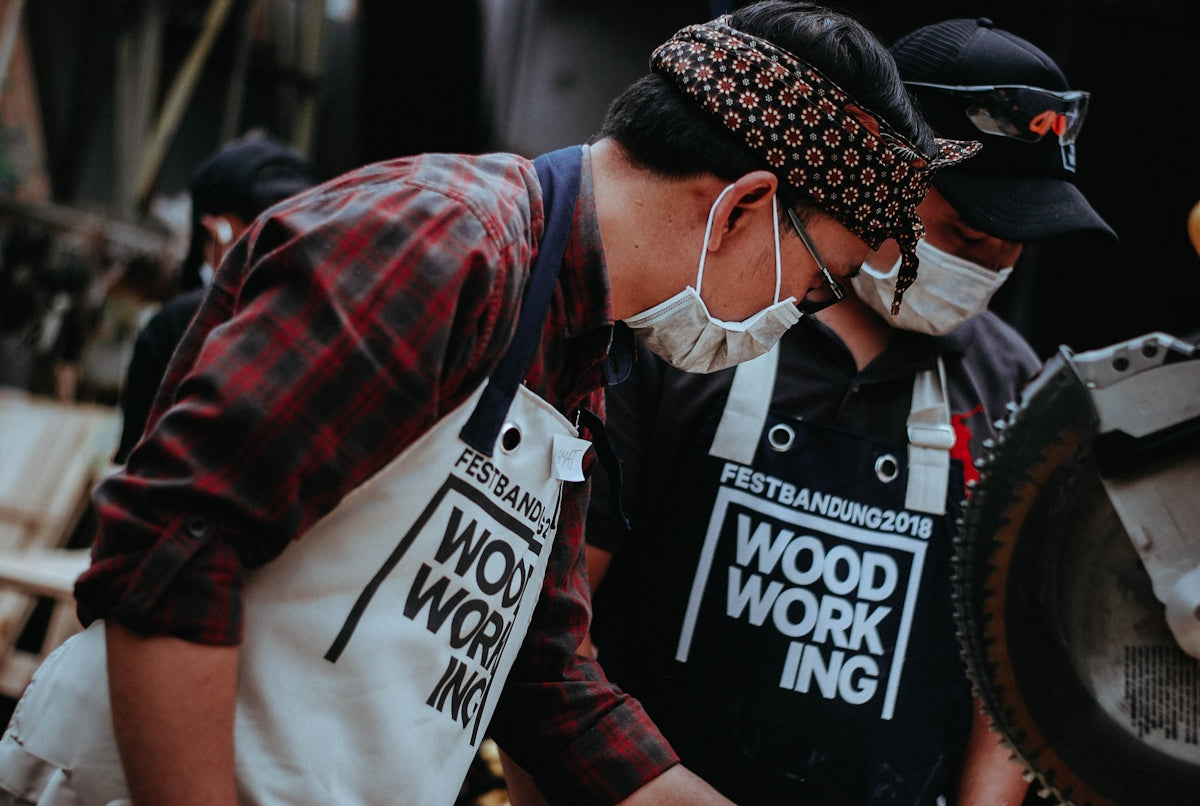 man wearing white apron and mask