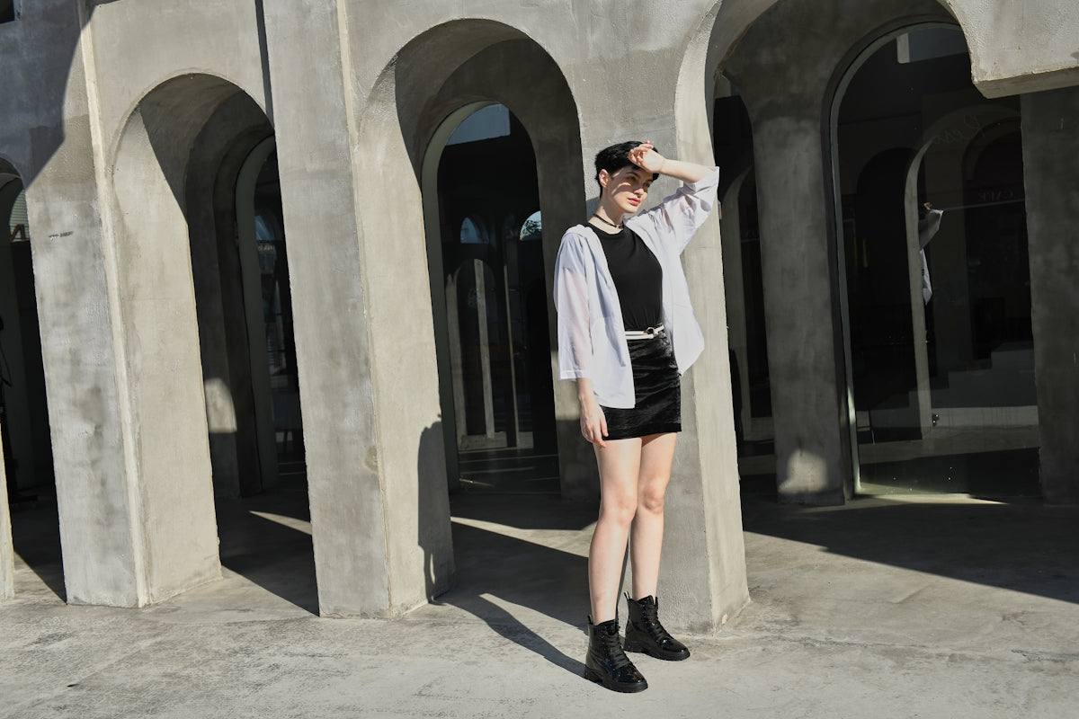a woman standing in front of a building