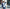 man standing in front of windows with mannequins