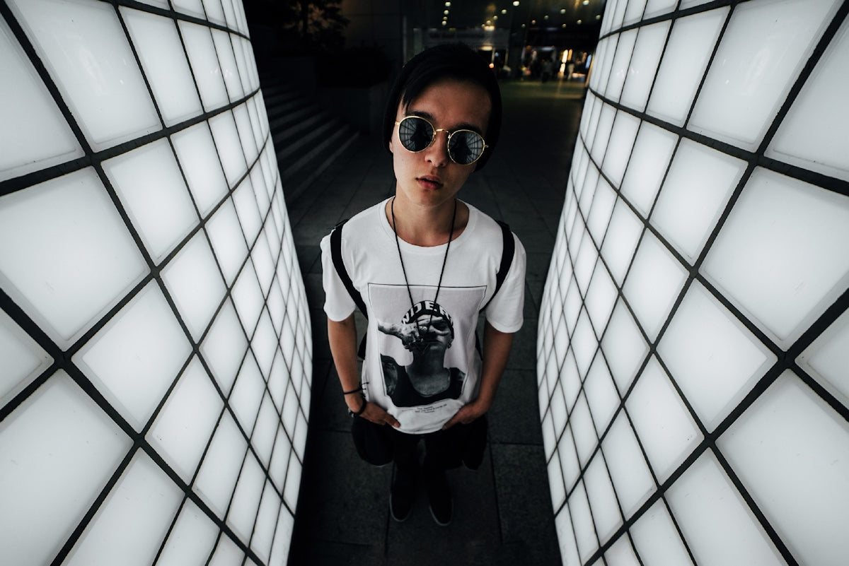 man in white crew neck t-shirt wearing black sunglasses